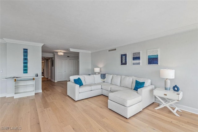 4031 Gulf Shore Blvd N Unit 95, Naples, FL 34103 - living room featuring light wood-style flooring, crown molding, and baseboards