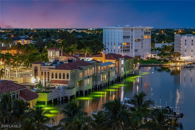 aerial view at dusk with a water view