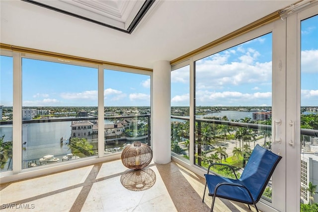 4031 Gulf Shore Blvd N Unit 95, Naples, FL 34103 - sunroom / solarium with a water view and floor to ceiling windows
