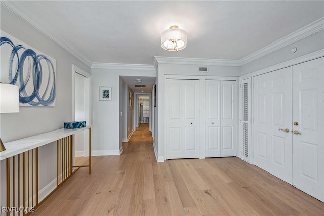 4031 Gulf Shore Blvd N Unit 95, Naples, FL 34103 - foyer entrance featuring light wood finished floors, baseboards, and ornamental molding