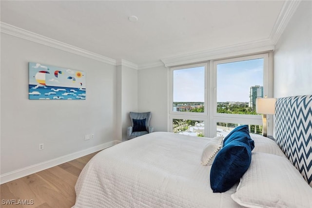 4031 Gulf Shore Blvd N Unit 95, Naples, FL 34103 - bedroom with crown molding, baseboards, and wood finished floors