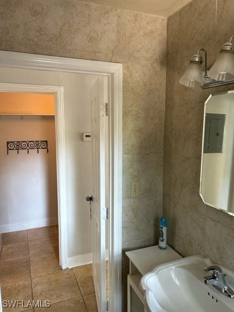 bathroom with sink and tile patterned flooring