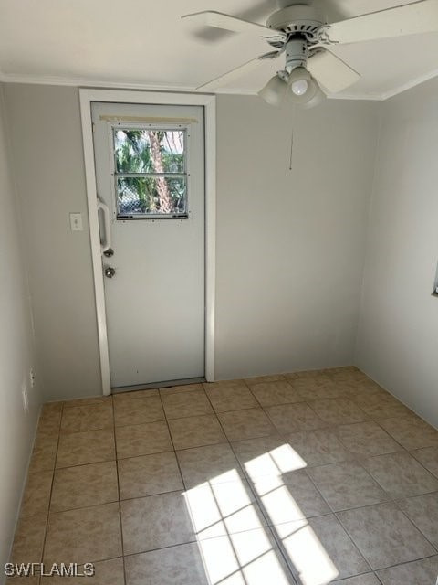 tiled empty room with ceiling fan