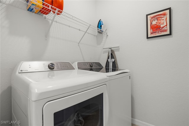 washroom with independent washer and dryer