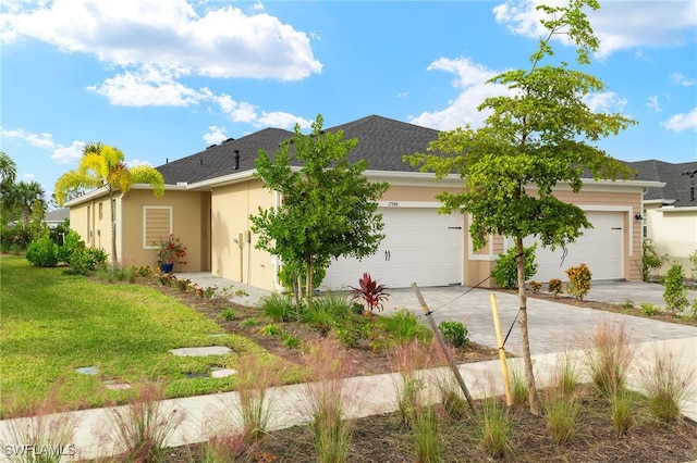 view of front of house with a front lawn and a garage