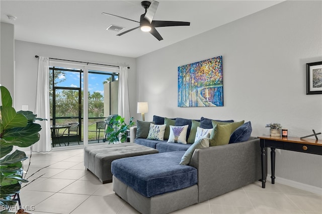 living room featuring ceiling fan and light tile patterned floors