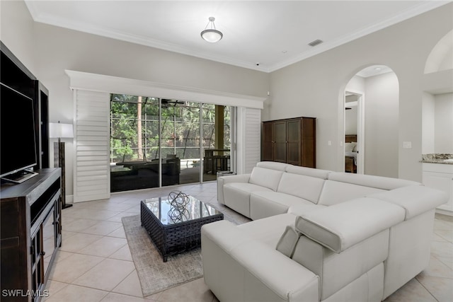 living room featuring crown molding and light tile patterned flooring