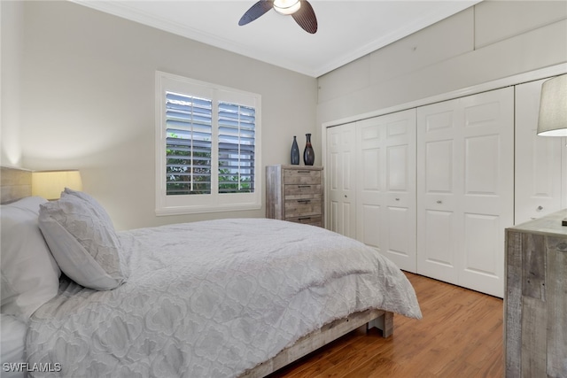 bedroom featuring a closet, hardwood / wood-style flooring, and ceiling fan