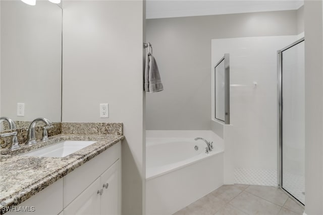 bathroom with tile patterned flooring, vanity, and separate shower and tub