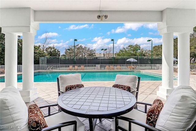 view of pool featuring a patio