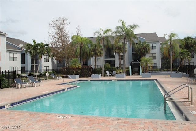 view of swimming pool with a patio area