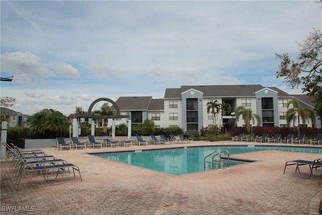 view of pool featuring a patio area