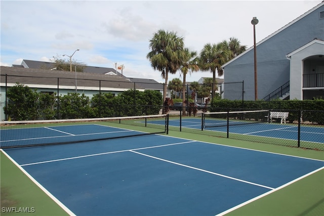 view of sport court with basketball hoop