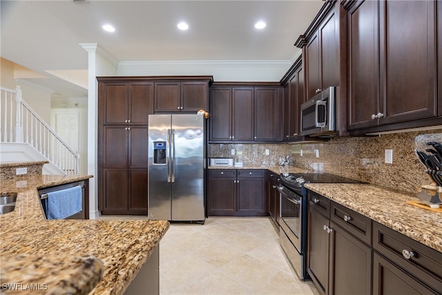 kitchen featuring appliances with stainless steel finishes, crown molding, tasteful backsplash, and light stone counters