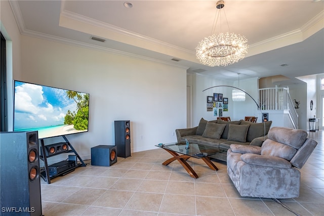 tiled living room with crown molding, a tray ceiling, and an inviting chandelier