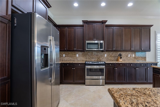 kitchen with crown molding, stainless steel appliances, and dark brown cabinetry