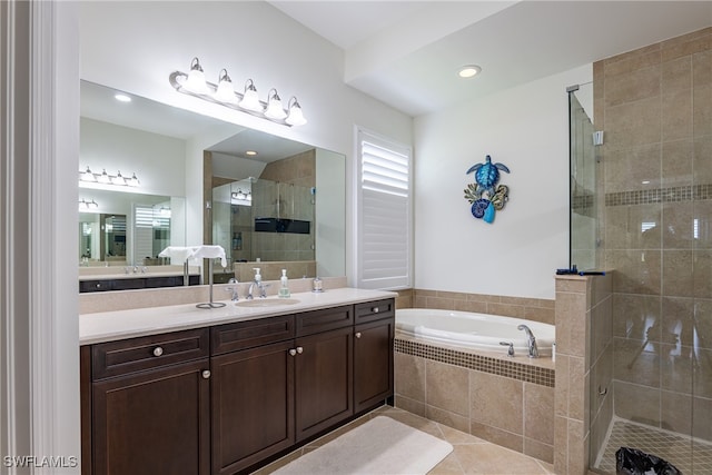 bathroom featuring vanity, shower with separate bathtub, and tile patterned floors