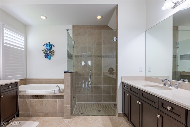 bathroom with vanity, tile patterned floors, and independent shower and bath