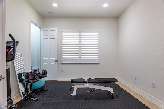 workout room with light tile patterned floors