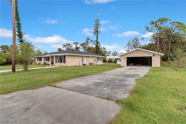 ranch-style home with a front yard and a garage