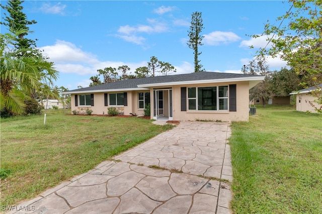 ranch-style house with a front lawn