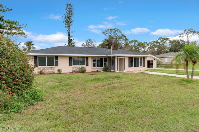 ranch-style house featuring a front lawn