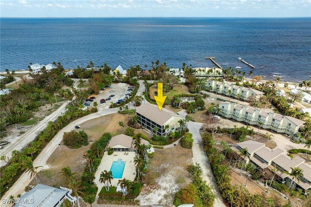 birds eye view of property with a water view