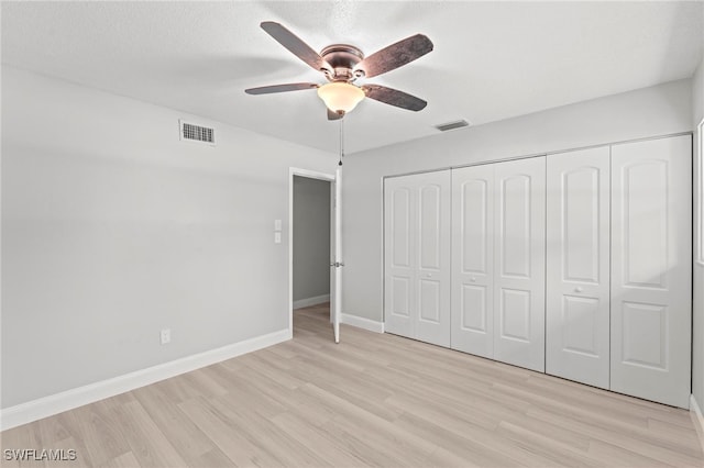 unfurnished bedroom featuring a closet, ceiling fan, and light hardwood / wood-style floors