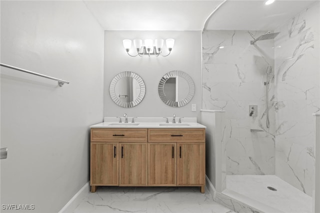 bathroom with vanity and a tile shower