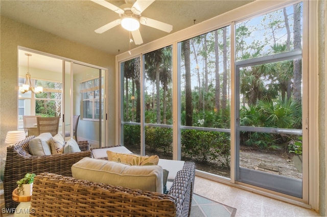 sunroom featuring ceiling fan