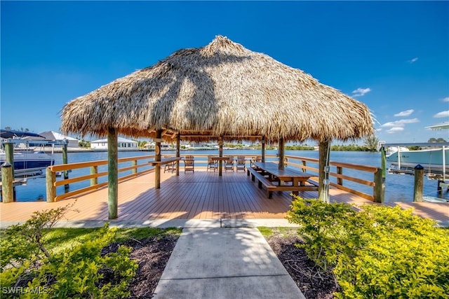 view of dock featuring a gazebo and a water view