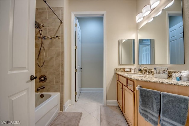 bathroom with baseboards, bathing tub / shower combination, vanity, and tile patterned flooring