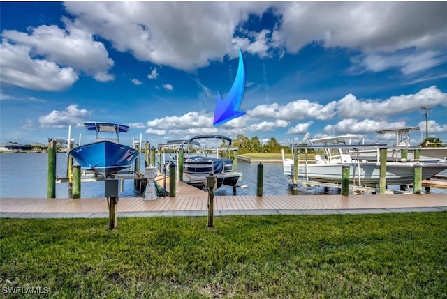 view of dock featuring boat lift, a lawn, and a water view