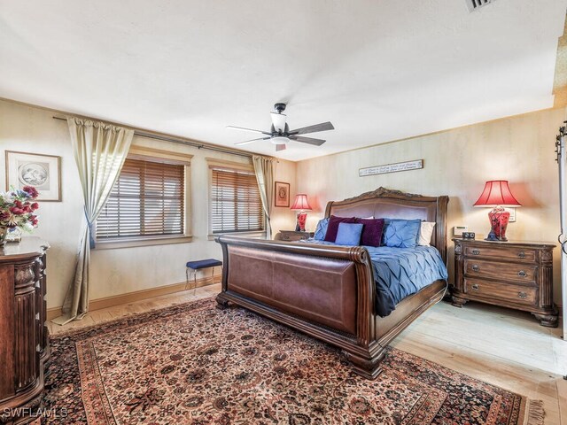 bedroom featuring hardwood / wood-style floors and ceiling fan