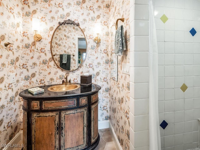 bathroom with tile patterned flooring and vanity