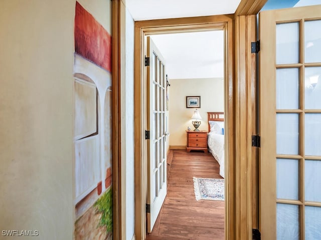 hall featuring hardwood / wood-style floors and french doors