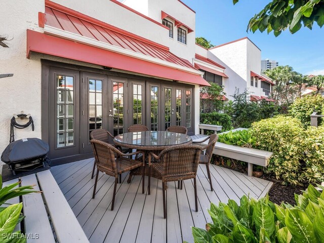 wooden terrace featuring french doors