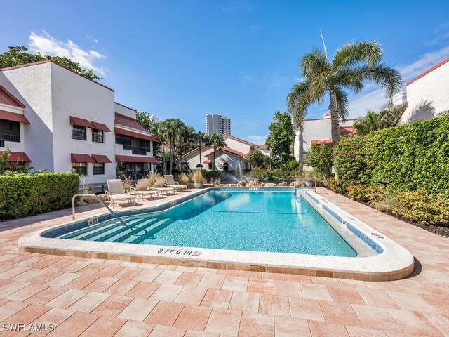 view of swimming pool featuring a patio