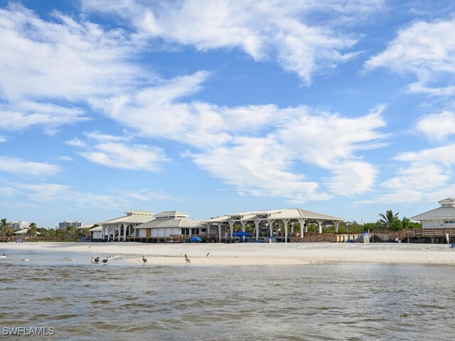 property view of water with a gazebo and a beach view