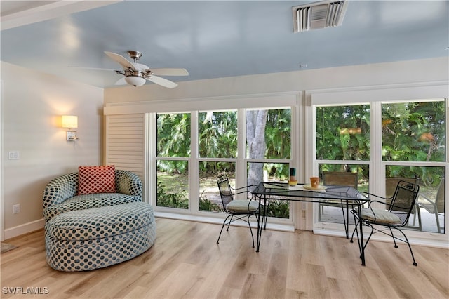 sunroom / solarium with ceiling fan