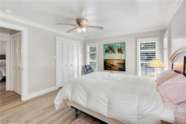 bedroom featuring ornamental molding, light hardwood / wood-style floors, multiple windows, and ceiling fan