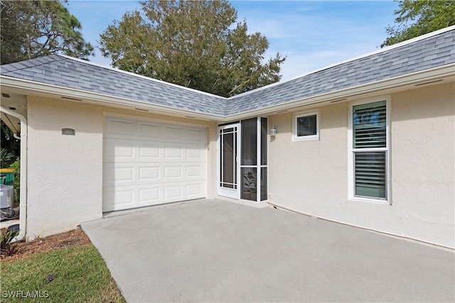 exterior space with a garage