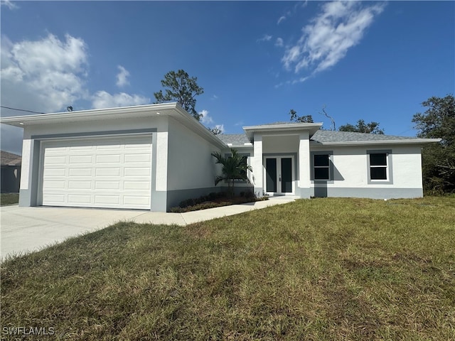 view of front facade featuring a front yard and a garage