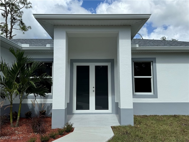 property entrance featuring french doors