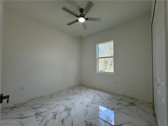 spare room with ceiling fan