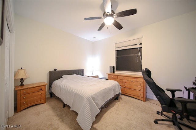 bedroom with ceiling fan and light colored carpet