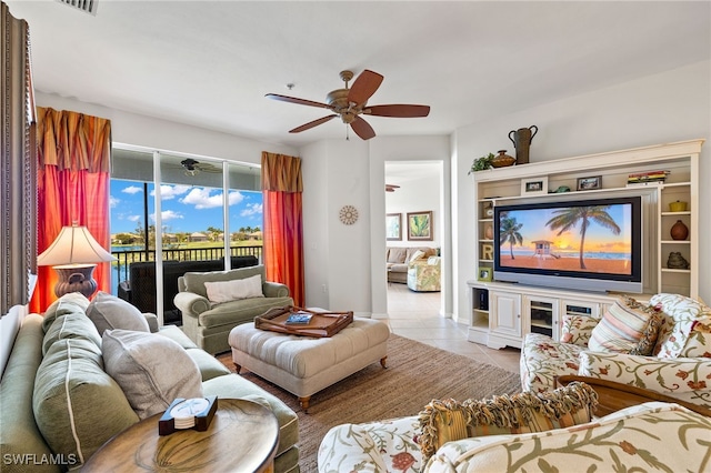 tiled living room featuring ceiling fan