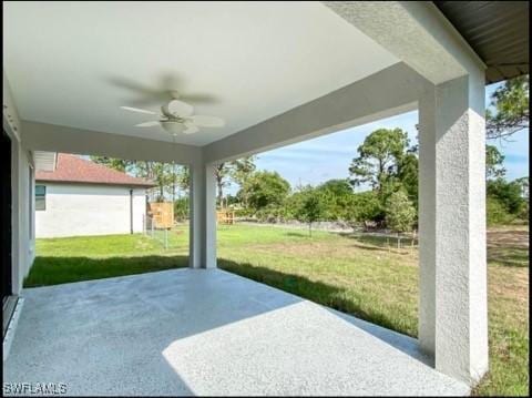 646 Chambers St E, Lehigh Acres, FL 33974 - view of patio featuring ceiling fan