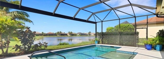 view of pool featuring a water view, a patio area, and glass enclosure