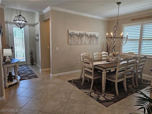 dining space with ornamental molding, an inviting chandelier, and light tile patterned floors